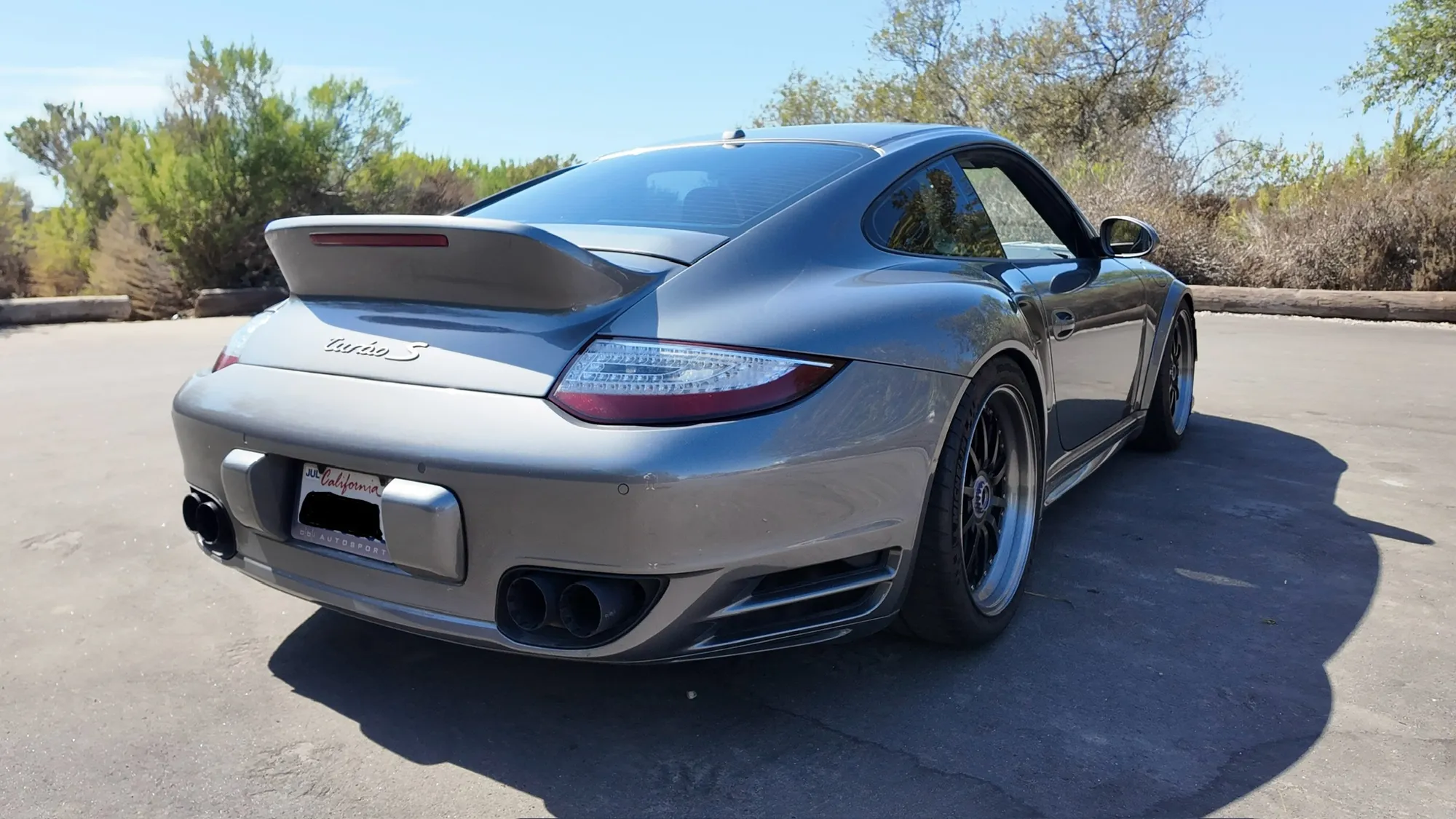 Rear three-quarter with the Turbo S wing raised
