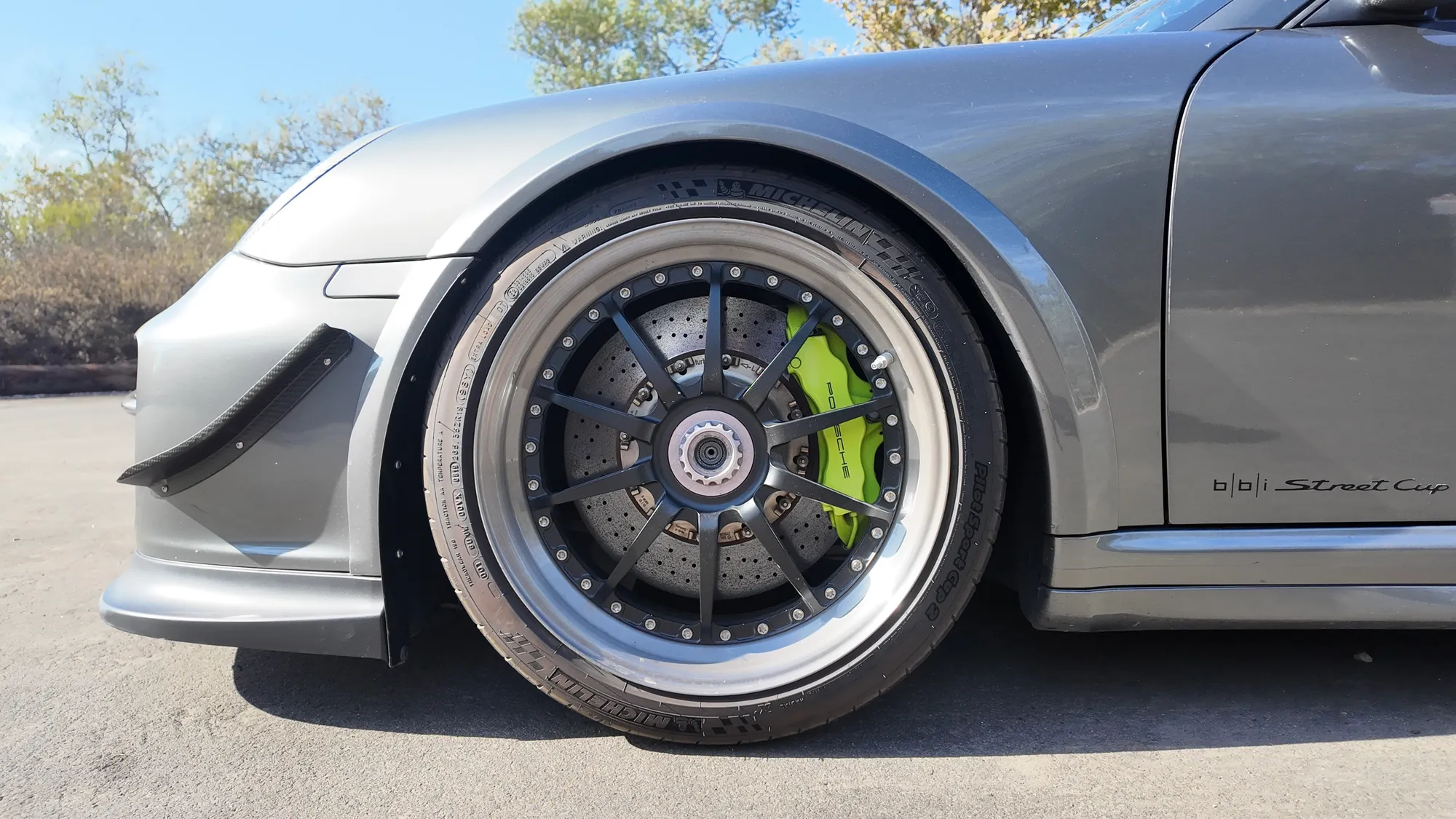Front wheel and brake, with the bbi Street Cup decal on the sill