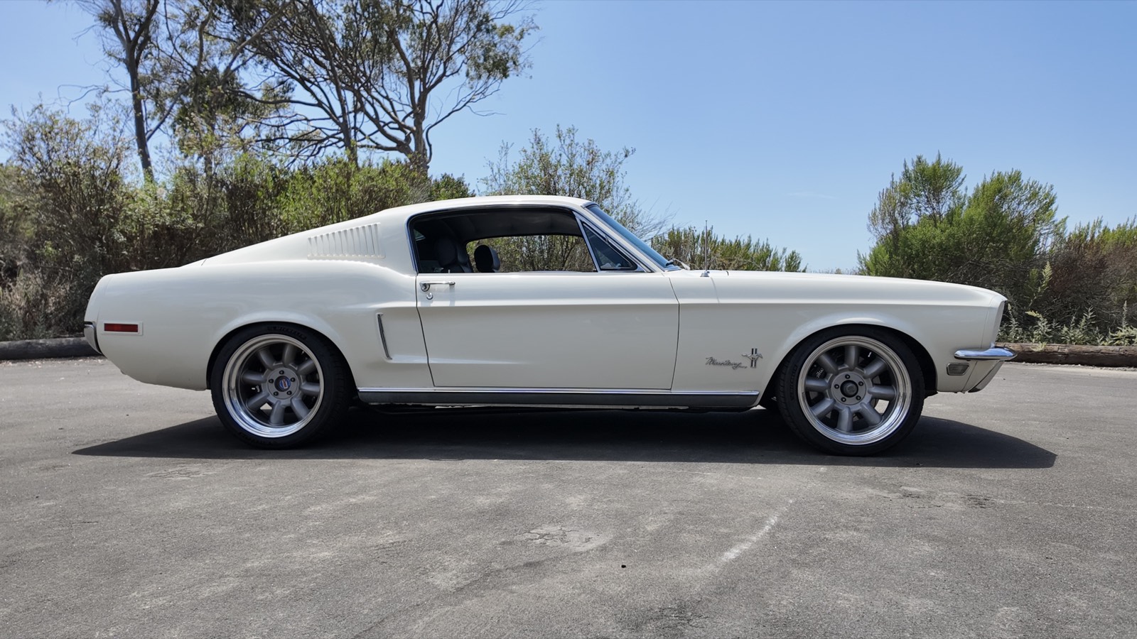Side profile showing the fastback roofline